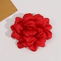 Close-up of red satin camellia fabric flower with layered petals and soft glossy finish - Red