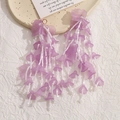 Detail of long purple acrylic flower earrings with multi-strand white bead tassels - Purple