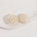 Detailed macro view of cream resin rose flower charms with marble texture for DIY jewelry - Off White