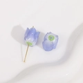 Macro detail of glitter purple acrylic rose bead with a gold metal pin for DIY jewelry - 1 Piece / Dark Blue