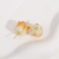 Macro detail of tulip-shaped acrylic beads with golden glitter for DIY jewelry making - 1 Piece / Apricot Pink