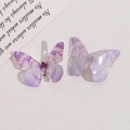 Dettaglio di ciondoli a farfalla in resina sfumata viola con paillettes per gioielli DIY - Viola chiaro