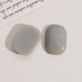 Close-up of polished gray oval resin charms for DIY jewelry and earring accessories - Gray