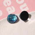 Detalle de cabuchón de resina con degradado azul y verde esmeralda y brillo estelar - Verde Lago