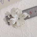 Macro detail of pearlescent white lily flower DIY accessory with central hole - Pearl White