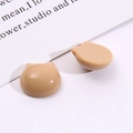 Close-up of polished resin cat-shaped DIY accessories in creamy milk tea color finish - Light Coffee
