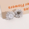 Macro detail of 3D grey mesh fabric flower accessories for DIY jewelry with stamen - Gray