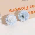 Detailed view of handmade light blue mesh flower accessory with layered petals and soft core - Light Blue