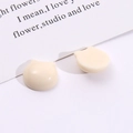 Detail of cream resin cat charms for DIY jewelry and hair accessories on a clean white background - Off-white