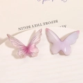 Dettaglio di farfalle con glitter rosa e ciondoli in resina viola per gioielli fai-da-te - Rosa Piccolo