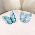 Blue gradient 3D butterfly earrings with bionic texture on a white plate background - Blue
