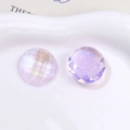 Macro detail of aurora purple faceted round glitter resin cabochons for DIY accessories - Purple