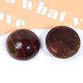 Detail of round oversized tortoiseshell resin charms showing glossy marble texture effects - Reddish Brown