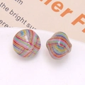 Macro shot of two vintage oil painting style colorful striped resin beads for DIY jewelry - Rainbow Radial Style (No. 6)