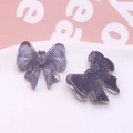 Detail of purple translucent resin bow accessories with fine glitter for DIY jewelry making - Purple