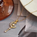 Elegant gold necklace with star and moon wand pendant featuring sparkling zircon accents - Gold