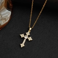 Elegant gold-plated cross necklace with sparkling cubic zirconia on black texture background - Gold Color Cross Necklace