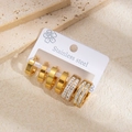 Dettaglio di set di 6 orecchini a cerchio in acciaio dorato con zirconi bianchi - Zirconia a Doppio Strato Piccola (1186) / Oro