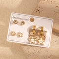 Lot de trois paires de boucles d'oreilles en acier doré avec étoiles de mer et zircons - Blanc