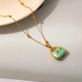 Detail of green handbag pendant necklace with gold bow and beaded chain for women - Green Style (0534)