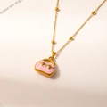 Close-up of gold chain necklace with pink enamel handbag pendant and small crystal - Pink Style (0537)