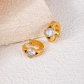 Detail of gold-plated hoop earrings featuring a large centered round clear zircon stone - White Eye Style (1414)