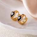 Macro view of gold hoop earrings with black heart charms and S925 engraved stamp - Black Heart Style (1422)