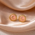 Macro shot of gold moon earrings with pink enamel inlay on luxury silk fabric - Moon Round Stud Earrings - Orange (1557)