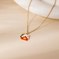 Christmas necklace featuring a red snow cabin and festive green tree pendant on gold chain - Snow House Pendant Necklace