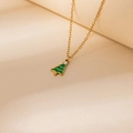 Detailed close-up of a golden cross chain necklace with a green enamel Christmas tree pendant - Christmas Tree Pendant Necklace