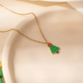Detail of Christmas tree pendant with green enamel and red bow on a gold chain - Bow Christmas Tree Necklace