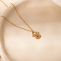 Detailed view of Christmas reindeer pendant necklace with red enamel nose on gold chain - Square Deer Necklace