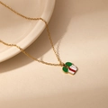 Detail of Christmas reindeer pendant necklace featuring enamel colors on a gold chain - Green Bow Gift Box Style (0758)