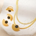 Detail of bohemian gold-plated jewelry set with black enamel and fan-shaped geometric cutouts - Hollow Black Enamel Jewelry Set