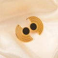 Detailed shot of gold fan-shaped hollow earrings with black circular inlay on satin - Hollow Black Enamel Earrings