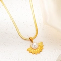 Detail of golden butterfly pendant necklace with white pearl on premium stone background - Fan Pearl Necklace
