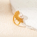 Detailed view of a vintage gold-plated ring with a fan-shaped design and a white pearl - Fan Pearl Ring