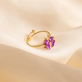 Macro shot of gold-plated ring with purple triangular zircon stones in clover shape - Purple Windmill Style (1650)