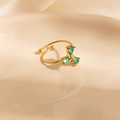Detail of adjustable gold ring featuring three green teardrop-shaped zircon stones - Green Three-Drop Style (1658)