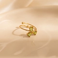 Detail of gold open ring featuring three green teardrop zircons in clover design - Light Green Three-Drop (1659)