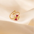 Macro detail of gold-plated windmill ring with colorful zircon crystals on silk background - White Windmill Style (1651)