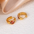 Golden hoop earrings with pear-cut red zircon stones on elegant champagne fabric - Amber Waterdrop Style (1433)