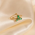 Macro view of golden clover ring with green marquise stones on elegant satin background - Green Clover Style (1639)