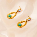 Vintage gold wing-style drop earrings with green cat-eye stone and blue crystal - Colored Zirconia Hollow Style (0482)