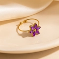 Gold six-petal flower ring with purple marquise zircon stones on white silk background - Purple Six-Petal Flower (1647)