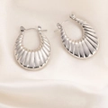Polished silver croissant hoop earrings with ribbed texture on white silk fabric - O-Shape Fan Textured Earrings 0221