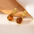 Detail of amber teardrop earring with hammered gold metal texture on wood background - Teardrop Amber Hammered Style (5813010231094) / Coffee Amber