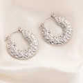 Elegant silver hammered texture hoop earrings on white satin fabric background - Round Hammered Texture Hoop Earrings 0230