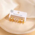 Three-piece gold stainless steel hoop earrings set with minimalist and pavé zircon styles - EXRGE1722