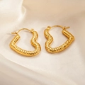 Golden heart-shaped stud earrings with hammered metal texture on silk fabric - Hammered Heart Earrings 0170